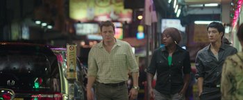 Movie still from “Blackhat” (2015), directed by Michael Mann – A man and a woman walking down a street; Medium shot, Over the shoulder angle