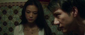 Movie still from “Blackhat” (2015), directed by Michael Mann – A man and a woman looking at one another; Close Up shot, Over the shoulder angle