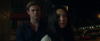 Movie still from “Blackhat” (2015), directed by Michael Mann – A man and a woman standing next to each other; Close Up shot, Low angle