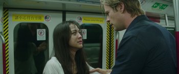 Movie still from “Blackhat” (2015), directed by Michael Mann – A man and a woman on a subway train; Close Up shot, Low angle