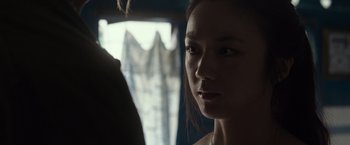 Movie still from “Blackhat” (2015), directed by Michael Mann – A person looking at the camera; Close Up shot, Over the shoulder angle