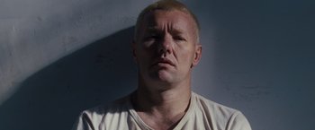Movie still from “Loving” (2016), directed by Jeff Nichols – A person wearing a white t - shirt; Close Up shot, Low angle