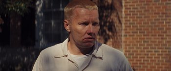 Movie still from “Loving” (2016), directed by Jeff Nichols – A person wearing a white shirt; Close Up shot, High angle