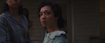 Movie still from “Loving” (2016), directed by Jeff Nichols – A woman in a sweater looking at the camera; Close Up shot, Over the shoulder angle