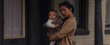 Movie still from “Loving” (2016), directed by Jeff Nichols – A woman holding a baby in her arms; Close Up shot, Over the shoulder angle
