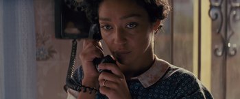 Movie still from “Loving” (2016), directed by Jeff Nichols – A woman holding a phone up to her ear; Close Up shot, High angle