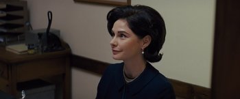 Movie still from “Loving” (2016), directed by Jeff Nichols – A woman in a black dress and a necklace; Close Up shot, Over the shoulder angle