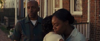 Movie still from “Loving” (2016), directed by Jeff Nichols – A man and a woman holding a young child; Close Up shot, Low angle