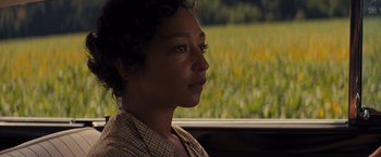 Movie still from “Loving” (2016), directed by Jeff Nichols – A woman sitting in a car looking out the window; Close Up shot, Over the shoulder angle