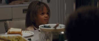 Movie still from “Loving” (2016), directed by Jeff Nichols – A little girl sitting at a table with food; Close Up shot, High angle