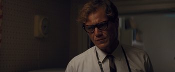 Movie still from “Loving” (2016), directed by Jeff Nichols – A person wearing glasses and a tie; Close Up shot, Low angle