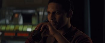 Movie still from “Loving” (2016), directed by Jeff Nichols – A man holding a video camera up to his face; Close Up shot, Over the shoulder angle