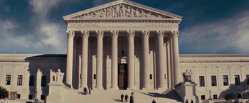 Movie still from “Loving” (2016), directed by Jeff Nichols – A group of people standing in front of a large building; Extreme Wide shot, Low angle