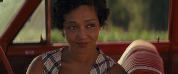 Movie still from “Loving” (2016), directed by Jeff Nichols – A woman's face in a plaid shirt; Close Up shot, Over the shoulder angle
