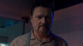 Movie still from “Marcella” (2016), created by Hans Rosenfeldt – A person wearing an apron; Close Up shot, Low angle