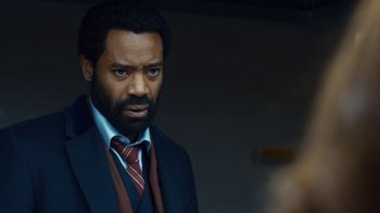 Movie still from “Marcella” (2016), created by Hans Rosenfeldt – A man in a suit and a tie; Close Up shot, Over the shoulder angle