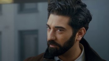 Movie still from “Marcella” (2016), created by Hans Rosenfeldt – A man with a beard and a jacket on; Close Up shot, Over the shoulder angle