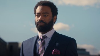 Movie still from “Marcella” (2016), created by Hans Rosenfeldt – A man in a suit and tie looking at the camera; Close Up shot, Over the shoulder angle