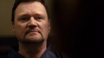 Movie still from “Marcella” (2016), created by Hans Rosenfeldt – A person wearing a blue shirt; Close Up shot, Over the shoulder angle