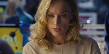 Movie still from “Marcella” (2016), created by Hans Rosenfeldt – A person with blonde hair; Close Up shot, Over the shoulder angle