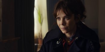 Movie still from “Marcella” (2016), created by Hans Rosenfeldt – A person wearing a jacket; Close Up shot, Over the shoulder angle