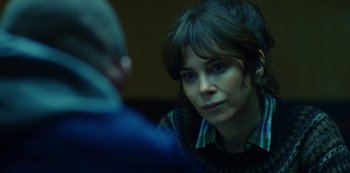 Movie still from “Marcella” (2016), created by Hans Rosenfeldt – A woman sitting in front of another person; Close Up shot, Over the shoulder angle