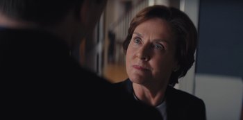Movie still from “Marcella” (2016), created by Hans Rosenfeldt – An older woman looking at a man in a suit; Close Up shot, Over the shoulder angle