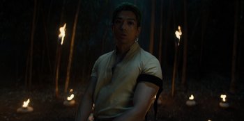 Movie still from “One Piece” (2023), directed by Marc Jobst – A man standing in the middle of a forest; Medium shot, Low angle
