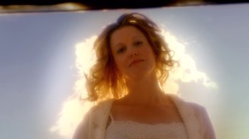Movie still from “Breaking Bad” (2008), created by Vince Gilligan – A woman in a white dress is looking at the camera; Close Up shot, Low angle