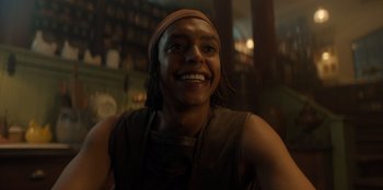 Movie still from “One Piece” (2023), directed by Marc Jobst – A man with long black hair smiling for the camera; Close Up shot, Low angle
