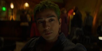 Movie still from “One Piece” (2023), directed by Marc Jobst – A person with green hair; Close Up shot, Low angle