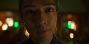 Movie still from “One Piece” (2023), directed by Marc Jobst – A person with green hair; Extreme Close Up shot, Low angle
