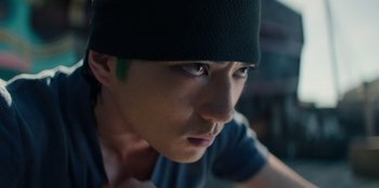 Movie still from “One Piece” (2023), directed by Marc Jobst – A person wearing a black hat; Close Up shot, Low angle