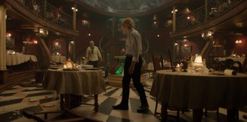 Movie still from “One Piece” (2023), directed by Marc Jobst – A man and a woman walking in a restaurant; Wide shot, Low angle