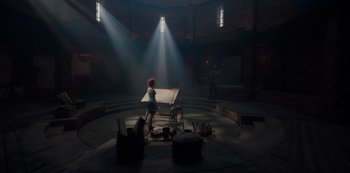 Movie still from “One Piece” (2023), directed by Marc Jobst – A woman standing in the middle of an empty room; Extreme Wide shot, High angle