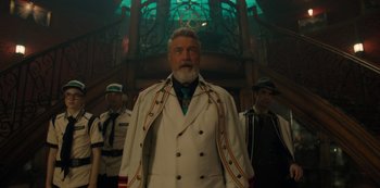 Movie still from “One Piece” (2023), directed by Marc Jobst – A group of men standing next to each other in a room; Medium shot, Low angle