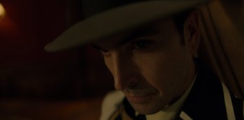 Movie still from “One Piece” (2023), directed by Marc Jobst – A person wearing a hat; Close Up shot, High angle