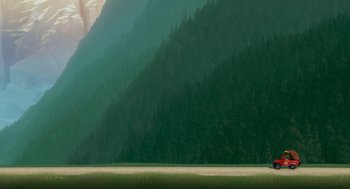 Movie still from “Open Season” (2006), directed by Roger Allers – A green mountain with trees in the background; Extreme Wide shot, Low angle