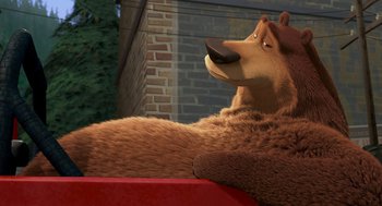 Movie still from “Open Season” (2006), directed by Roger Allers – A brown bear laying on top of a red truck; Medium shot, High angle