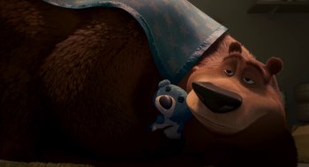 Movie still from “Open Season” (2006), directed by Roger Allers – A stuffed bear is laying under a blanket on the ground; Medium shot, High angle