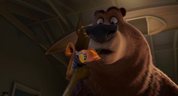 Movie still from “Open Season” (2006), directed by Roger Allers – A brown bear is holding an object in his mouth; Close Up shot, High angle