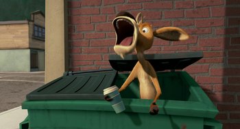 Movie still from “Open Season” (2006), directed by Roger Allers – An animated dog holding a cup of coffee in its mouth; Medium shot, High angle