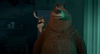 Movie still from “Open Season” (2006), directed by Roger Allers – A couple of animals standing next to each other in a room; Medium shot, Over the shoulder angle