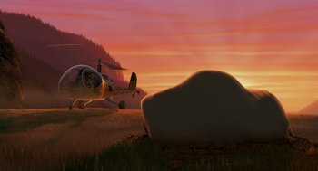 Movie still from “Open Season” (2006), directed by Roger Allers – A helicopter flying over a field at sunset; Extreme Wide shot, Low angle