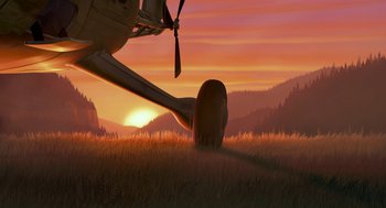 Movie still from “Open Season” (2006), directed by Roger Allers – An airplane is in a field at sunset; Extreme Wide shot, Low angle