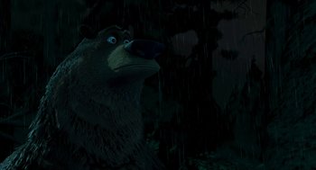 Movie still from “Open Season” (2006), directed by Roger Allers – A brown bear standing in the rain next to a tree; Close Up shot, Low angle
