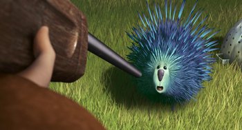 Movie still from “Open Season” (2006), directed by Roger Allers – An animated porcupine being hit by a wooden hammer; Close Up shot, Over the shoulder angle