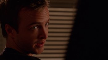 Movie still from “Breaking Bad” (2008), created by Vince Gilligan – A man's face in the dark; Close Up shot, Over the shoulder angle