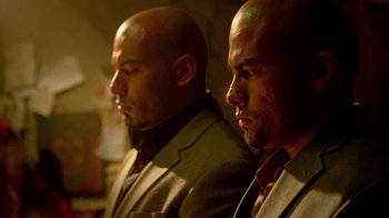 Movie still from “Breaking Bad” (2008), created by Vince Gilligan – A couple of men standing next to each other; Close Up shot, Low angle