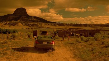 Movie still from “Breaking Bad” (2008), created by Vince Gilligan – A car parked on the side of a dirt road; Extreme Wide shot, High angle